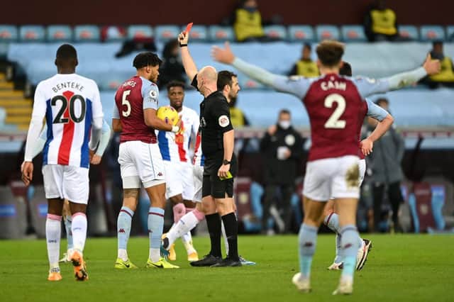 Tyrone Mings of Aston Villa is shown a second yellow and then a red card during the Premier League match between Aston Villa and Crystal Palace. (Photo by Shaun Botterill/Getty Images)