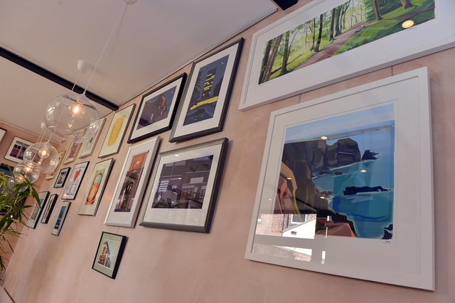 Artworks sold at The Framery include colourful landscapes and images of local landmarks.