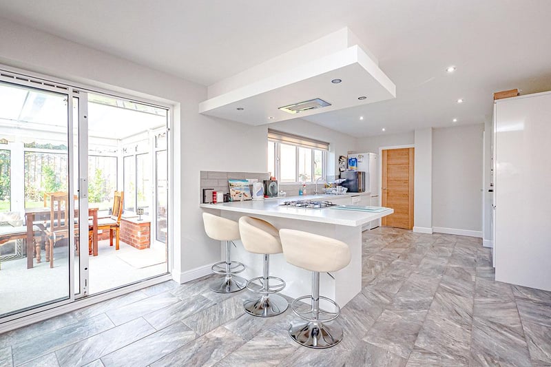 To the rear of the kitchen is a breakfast bar area and space large enough to accommodate a family dining table.