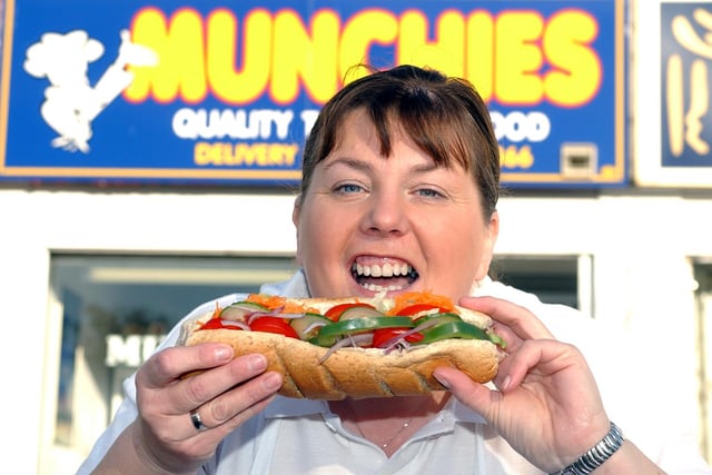Lynn Crutwell is pictured with a sandwich from Munchies in Prince Edward Road 17 years ago.