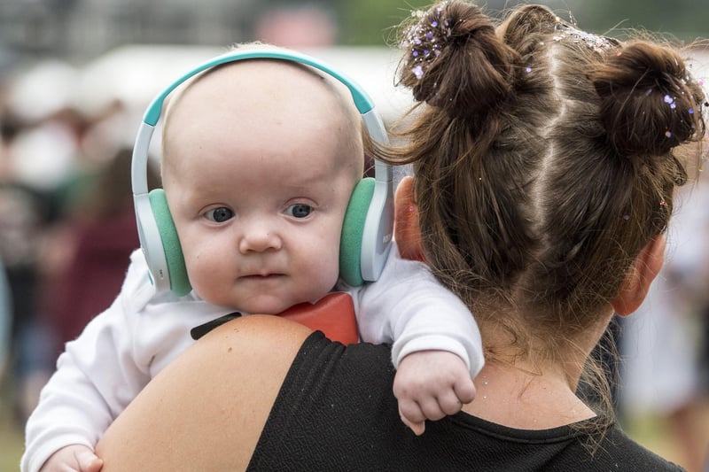 Baby Sam takes precautions to protect his ears as his favourites Stereophonics rock the crowd at Tramlines 2018