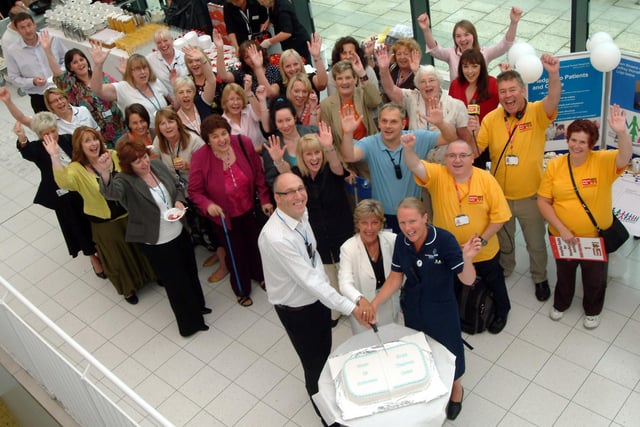 Staff at The Kings Treatment Centre in Sutton celebrated the centre's First Anniversary in 2009, Chief Executive Jeffrey Worrall, Chairman Tracy Doucet and Department Nurse Leader Mandy Topliss cut the cake to mark the celebrations watched by staff members.