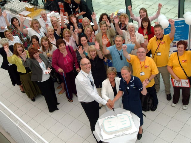 Staff at The Kings Treatment Centre in Sutton celebrated the centre's First Anniversary in 2009, Chief Executive Jeffrey Worrall, Chairman Tracy Doucet and Department Nurse Leader Mandy Topliss cut the cake to mark the celebrations watched by staff members.