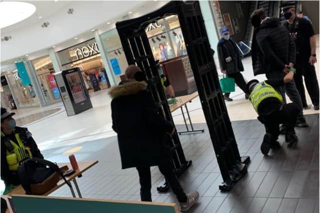 Police arrested a woman in the Frenchgate Centre who was carrying two large knives.