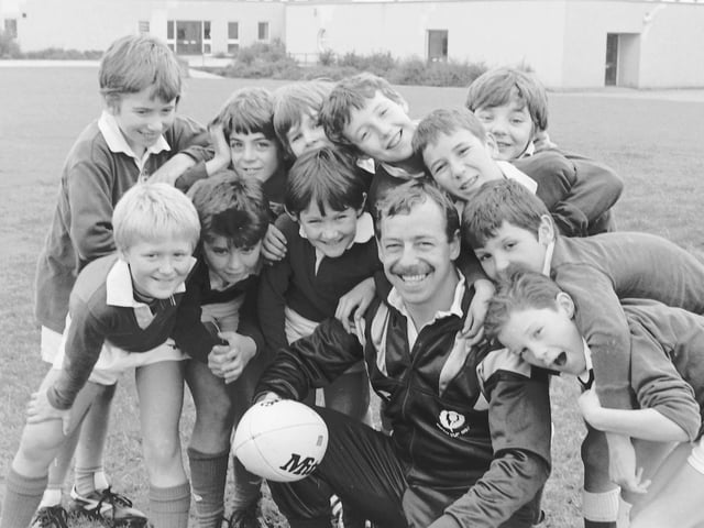 Former Jed-Forest and Scotland scrum-half Roy Laidlaw with some young hopefuls from Wilton Primary School at Stirches, Hawick, October 1988.