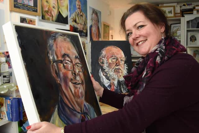 Artist Sue Clayton with her portrait of Sainbury's trolley attendant Andrew Fair for her York Heroes project.