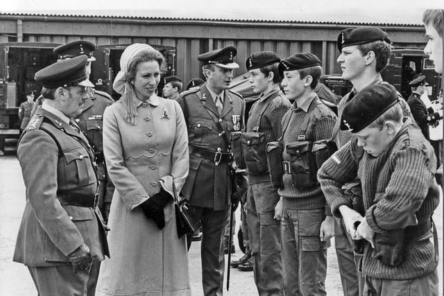 Last minute adjustments by one harrassed cadet as Princess Anne inspects her troops at the Manor TA Centre, Sheffield, July 1980