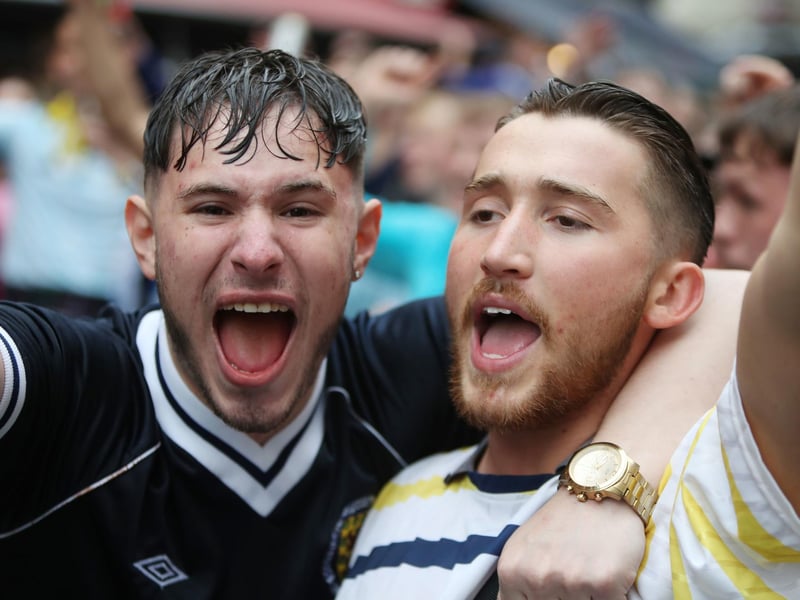 Friends cheer Scotland on together in Leicester Square (Photo: Kieran Cleeves/PA Wire).