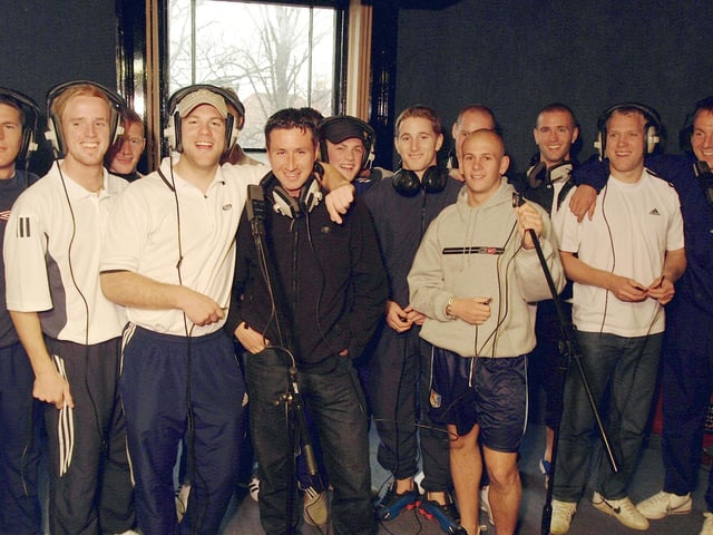 Mansfield Town's players in the recording studio as they marked promotion with a record.