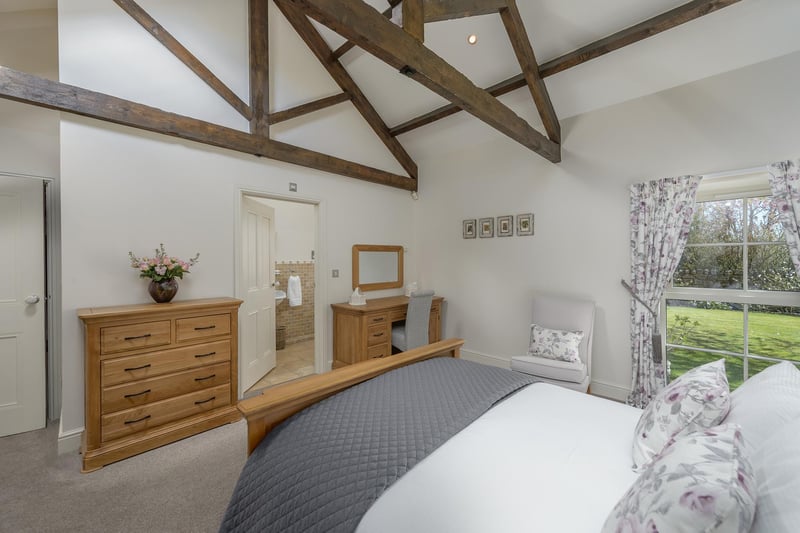 The ground floor also offers bedroom accommodation, with the master bedroom featuring a charming vaulted ceiling and sizeable en-suite complete with shower unit. There are two further good sized double bedrooms to the ground floor.