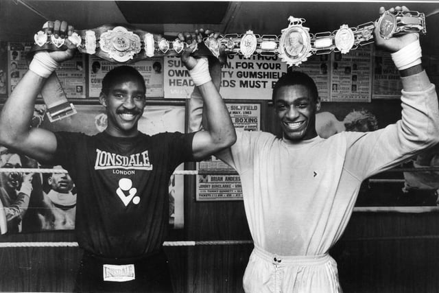 Boxer, Herol Bomber Graham (right) with his British Middleweight Championship Belt. May 1985