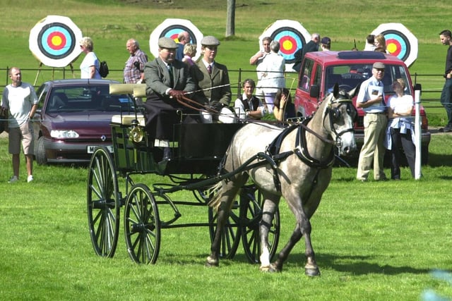 Competitors in the  horse driving events are seen in the ring in 1998