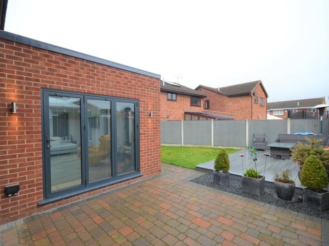 Gated access at both sides of the property leads to the rear garden.  
Gar.age - Having a remote electric steel up and over door, internal access from the entrance hall, power, lighting and provisions for a wall mounted gas combi boiler.  
The rear garden is fully enclosed with wooden fence boundaries offering a good degree of privacy.
This well presented garden enjoys a block paved patio seating area, an additional raised composite decking seating area, shaped lawn, outdoor lighting and a cold water tap.