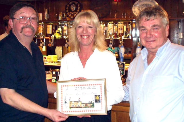 Eric Gilbert, chairman of Barnsley CAMRA, presented the pub of the season award to Heather and Mike  of the Edmund Arms, Worsbrough in 2004