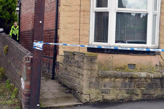 Police on Rockley Road in Sheffield, where a man was found dead in a house