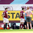 Burnley's Johann Berg Gudmundsson (floor) receives medical attention before being carried off the pitch on a stretcher: Jon Super/NMC Pool/PA Wire.