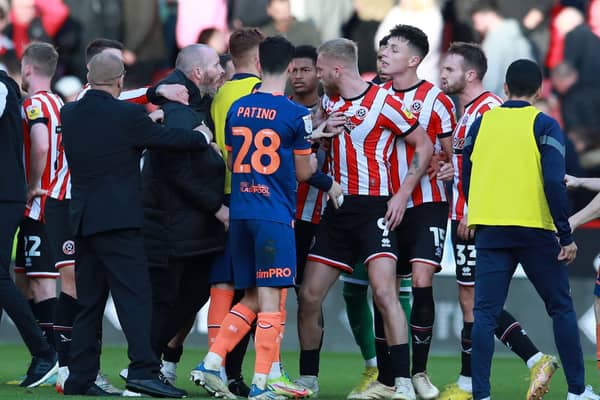 Sheffield United's Oli McBurnie gets involved as a post-match melee broke out following the Blades' draw with Blackpool: Simon Bellis / Sportimage