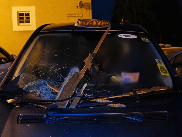 Debris smashed a taxi windscreen that was parked not far from the sight of the explosion.