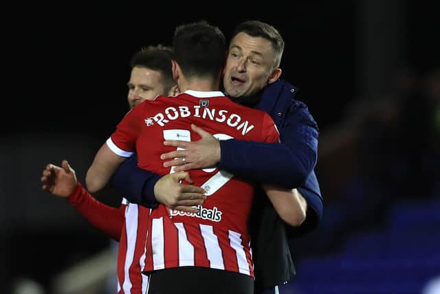 Sheffield United's Jack Robinson celebrates with manager Paul Heckingbottom: Leila Coker/PA Wire.