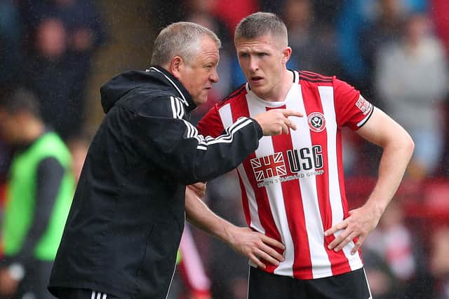 Chris Wilder, manager of Sheffield United gives instructions to John Lundstram (Photo by Catherine Ivill/Getty Images)