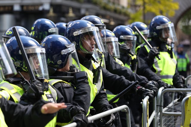 Police are confronted by protesters in Whitehall near Parliament Square, London. Picture: Jonathan Brady/PA Wire
