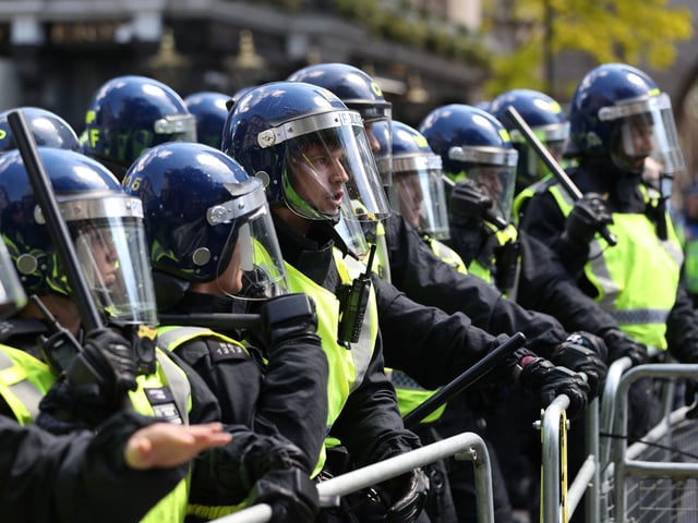 Police are confronted by protesters in Whitehall near Parliament Square, London. Picture: Jonathan Brady/PA Wire