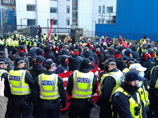 Here is what looks like a group of marchers being kettled in Holland Street, just off the main march route of St Vincent Street.