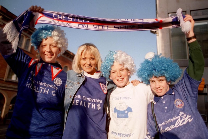 Glapwell born glamour model Joanne Guest returned to her home town for a Big Breakfast outside broadcast ahead of Chesterfield FC's match against Middlesbrough in the semi-final of the FA Cup in 1997. Joanne is pictured with young supporters David Fareham, Adam Fareham and Tom Pidcock.