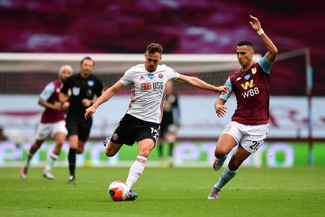 Jack Robinson of Sheffield United is challenged by Anwar El Ghazi of Aston Villa during the Premier League match between Aston Villa and Sheffield United at Villa Park on June 17, 2020: Shaun Botterill/Getty Images