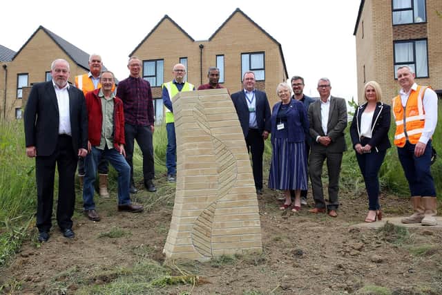 Artist Howard Bowcutt along with respesentatives from Sheffield Housing Company, The Council and other contractors with one of the pieces of art installed around Norfolk Park, Sheffield, United Kingdom, 7th June 2022. Photo by Glenn Ashley Photography