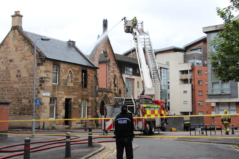 Some of the damage to the church is visible in this picture taken on Wednesday morning as firefighters continued to hose the building to ensure all of the flames had been put out.