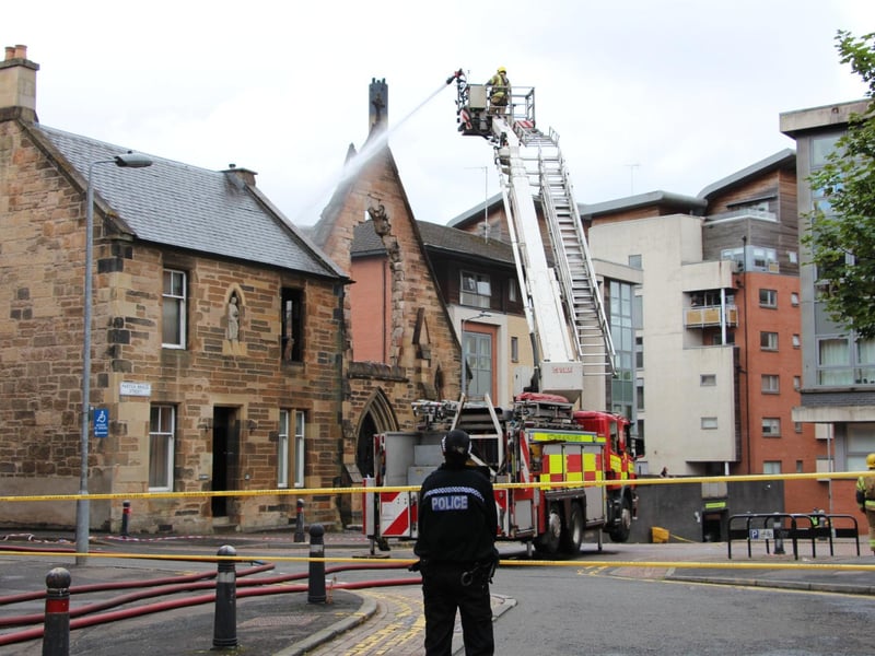 Some of the damage to the church is visible in this picture taken on Wednesday morning as firefighters continued to hose the building to ensure all of the flames had been put out.