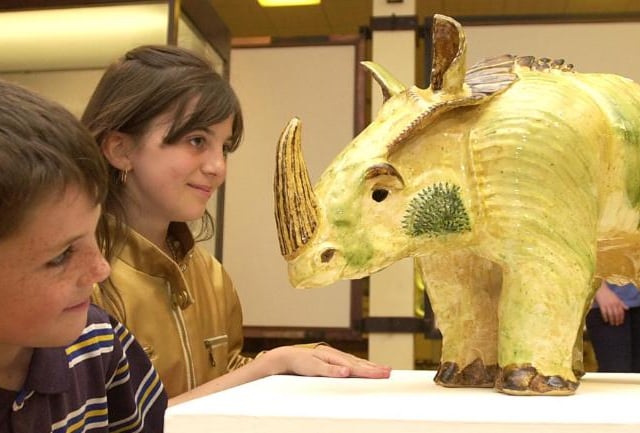 Sprotbrough artist Keith Mason made this rhino sculpture in 2001. Children Joe and Charlotte Cortness at the Doncaster Museum and Art Gallery.