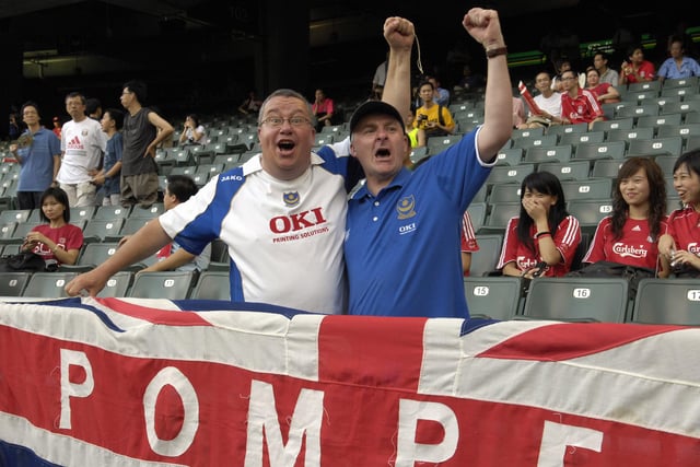 Jeff Rosier and Paul Banks, both from Portsmouth, cheer for Pompey in the Hong Kong Stadium.