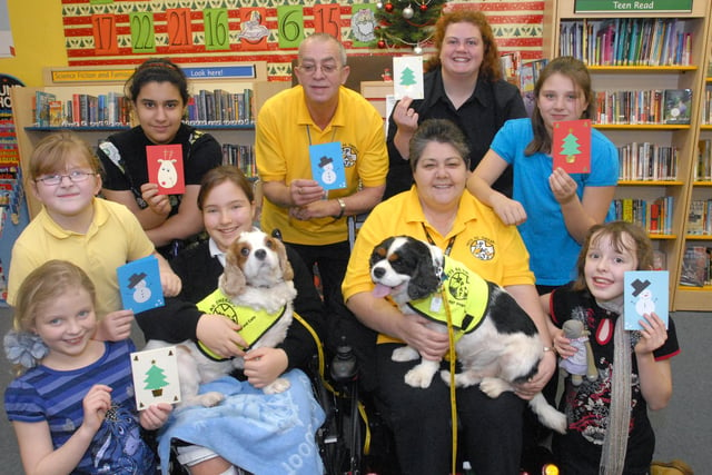 The Chatter Books reading group was pictured with representatives of Pets For Therapy in 2007.