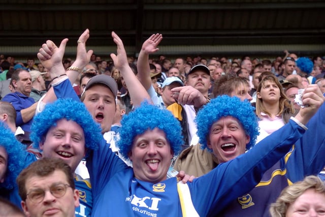 It might have been a bad hair day for these fans -  but at least they came well-prepared for the party!
