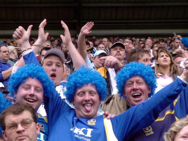 It might have been a bad hair day for these fans -  but at least they came well-prepared for the party!