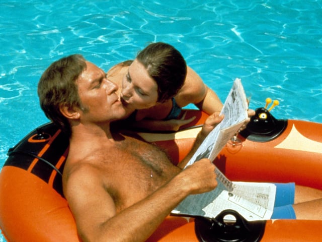 Christopher Plummer with Catherine Schell in The Return Of The Pink Panther in 1975.