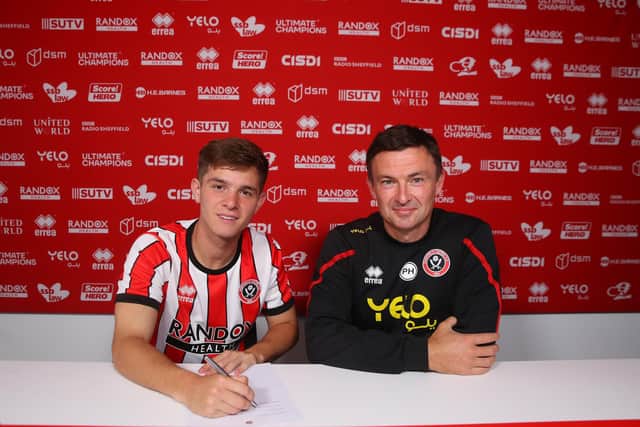 James McAtee puts pen to paper after signing for Sheffield United from Manchester City: Simon Bellis/Sportimage