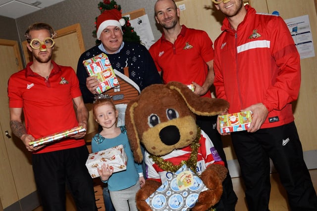 James Coppinger, Paul Keegan, Donny Dog and Dean Furman with six-year-old Laya Wilkinson in DRI at Christmas 2014