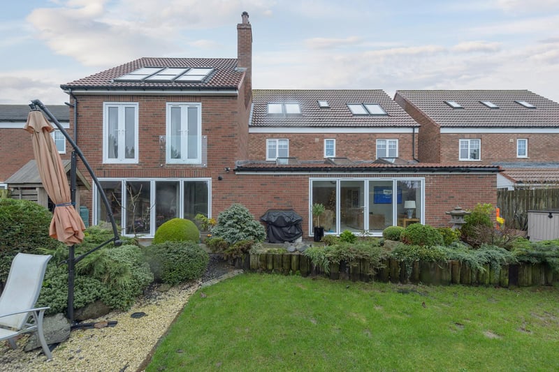 Externally the property benefits from a sizeable, beautifully presented rear garden with a combination of stone paving and decking bordering the lawn. To the front of the property, the building benefits from use of a single garage to the east elevation and a tarmac driveway.