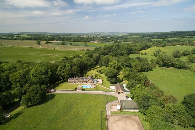 The four-acre property boasts stunning views.