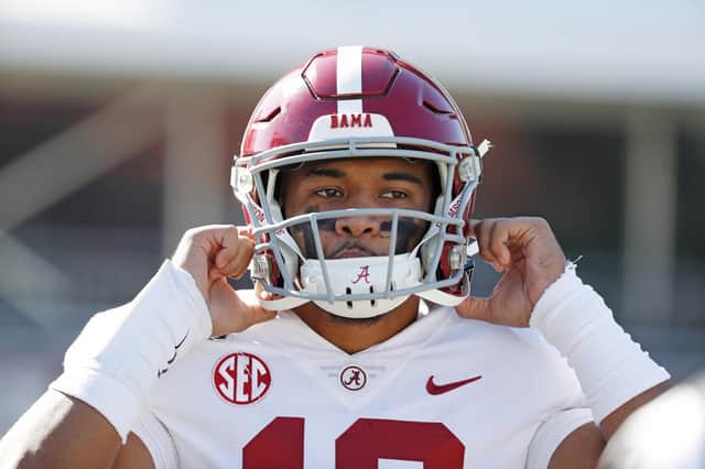Alabama quarterback Tua Tagovailoa (13) adjusts his helmet before an NCAA college football game against Mississippi State in Starkville.