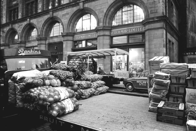 The Edinburgh Fruit Market at Market Street, Edinburgh, on the last day before it transferred to Gorgie. A Rankin's lorry is pictured.