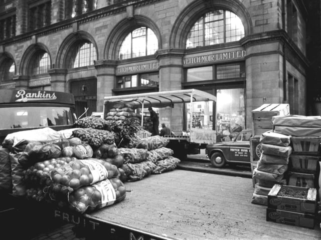 The Edinburgh Fruit Market at Market Street, Edinburgh, on the last day before it transferred to Gorgie. A Rankin's lorry is pictured.