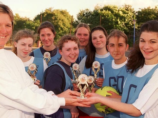 Anita Hall presents the trophies to the Stocksbridge Works Junior Netball team from left.. Kerstin Jones, Sarah Elliott, Stephanie Hawsworth, Claire Anyon, Becky Burton, Helen Woodhams, Claire Roebuck and Hannah Ralph (captain), July 1998