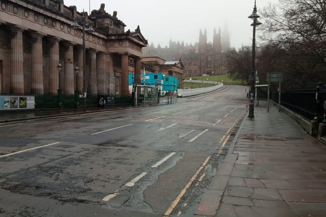 The Mound in Edinburgh is a popular route for buses, cars and pedestrians to travel through this city, but this morning it was pictured completely abandoned as residents take the recent 'stay at home' rules seriously