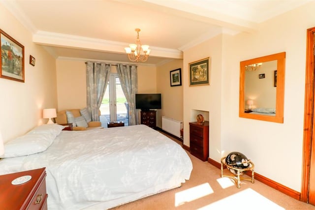 The property has four double bedrooms, including two master bedrooms, and two single bedrooms.