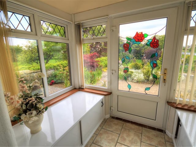 The front conservatory is situated specifically to look over the landscaped gardens.
