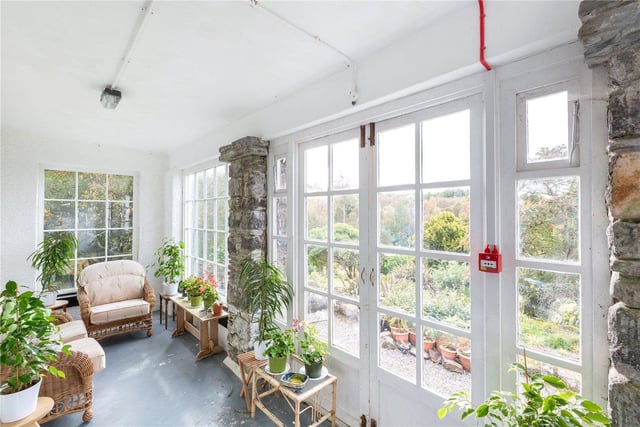 New owners can enjoy views of the garden from this sun room.